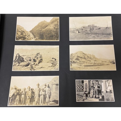 227 - An early 20th century photograph album, including military and travel photographs -