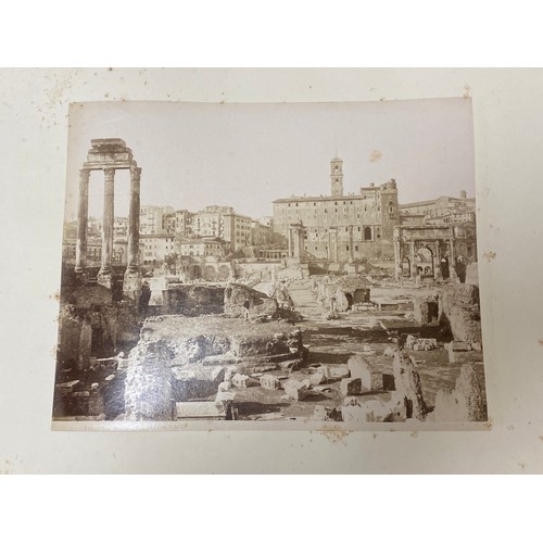 228 - A 19th century photograph album, mostly containing Grand Tour views of Italy -