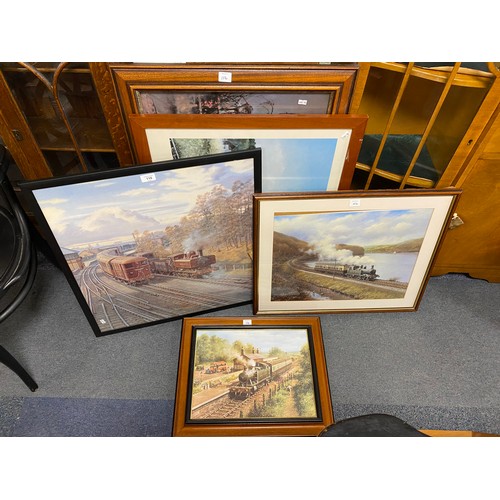 107 - A 20th century oil of a steam train and a quantity of prints (10) -