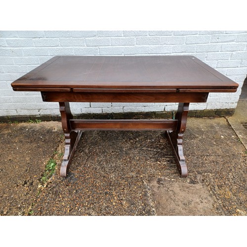 215 - A Ercol drawer leaf dining table and a set of six Ercol Prince of Wales/Fleur de lys back chairs -