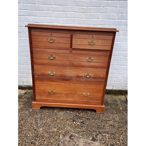 216 - An Edwardian chest of drawers, fitted with two short and three long drawers, to short feet -