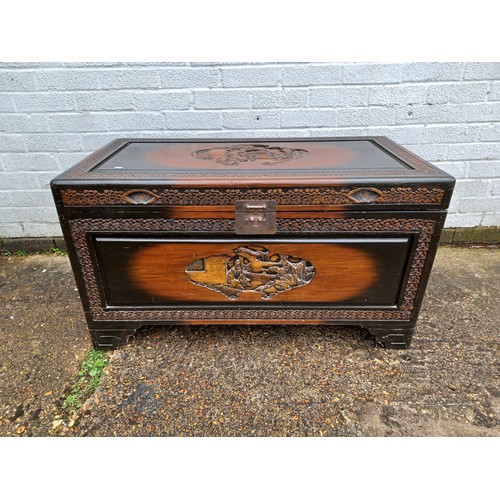 217 - A carved camphor blanket chest, with figural carving -