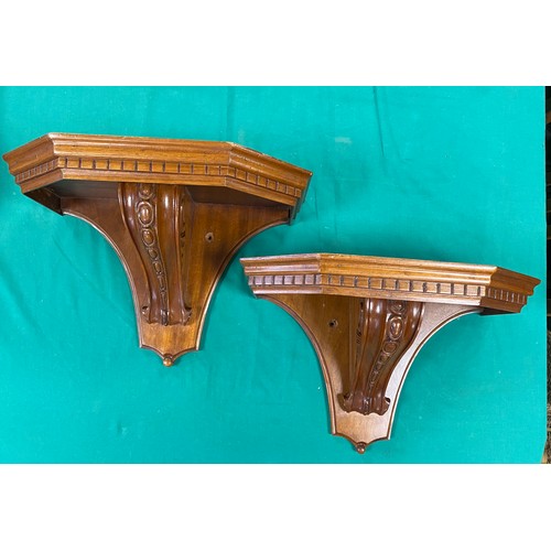 225 - A pair of carved and scrolled wall brackets, together with another mahogany wall bracket with line i... 