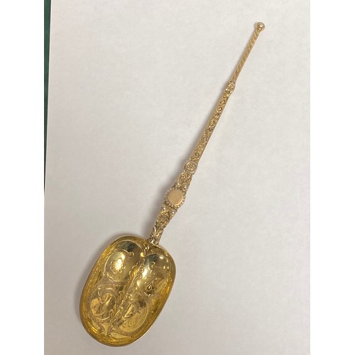 4 - A late Victorian silver gilt copy of the coronation annointing spoon, London 1897, of large size -