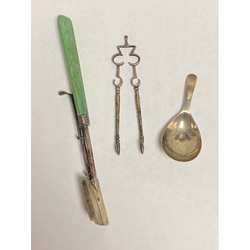 6 - A George III silver caddy spoon, London 1800, together with a pair of Victorian silver tongs and a c... 