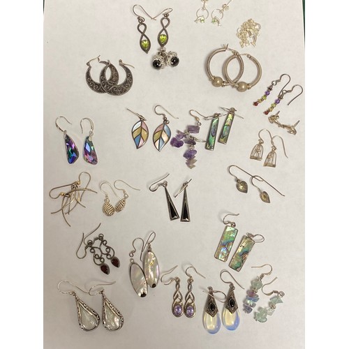 9 - A quantity of silver mounted earrings, some stone set -