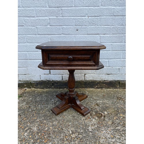 230 - A small oak table, with octagonal top, single drawer and turned support -