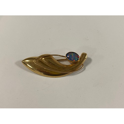 14 - A 9ct gold brooch set with an opal cabochon, together with a 9ct gold coin set ring, a 9ct wedding b... 