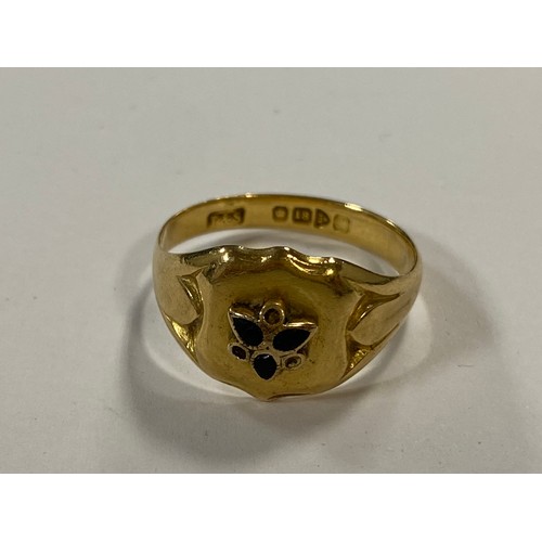 32 - An 18ct gold ring, with shield shape panel to front -