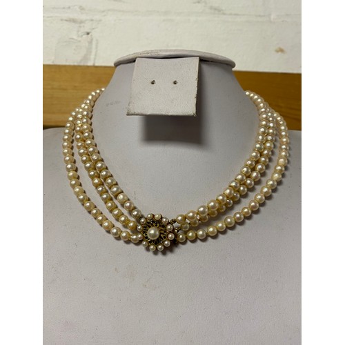 35 - A triple row pearl necklace to 9ct gold clasp, together with 9ct gold ring set with a sapphire betwe... 