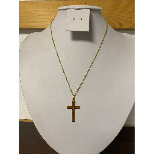 38 - A 9ct gold cross pendant on chain -