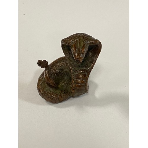 71 - A small bronze of a rearing cobra -