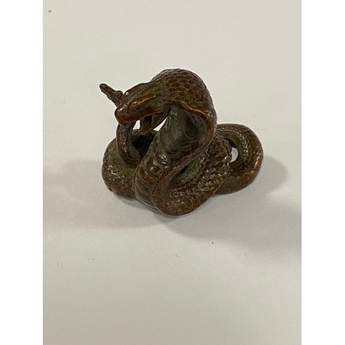 71 - A small bronze of a rearing cobra -