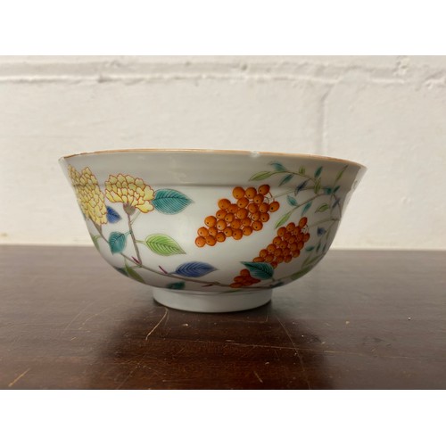 84 - A Chinese bowl, the exterior painted with flower and butterflies, the interior painted with blue and... 