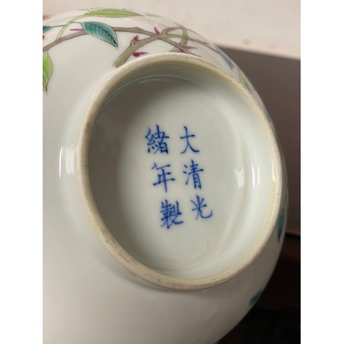 84 - A Chinese bowl, the exterior painted with flower and butterflies, the interior painted with blue and... 