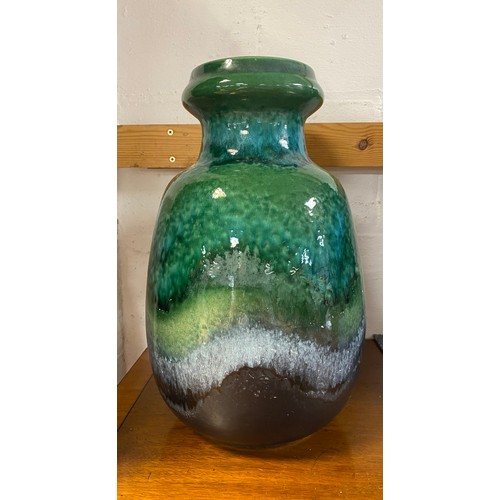 94 - A large German studio pottery floor vase, glazed in mottled blues and greens -