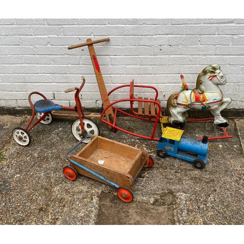 194 - A group of vintage toys, including child's rocker, scooter, tricycle etc -