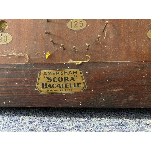 209 - A vintage 'Scora' bagatelle board, together with a box of Bayko -