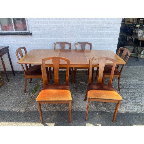 237 - A teak dining suite, comprising extending table and six dining chairs -