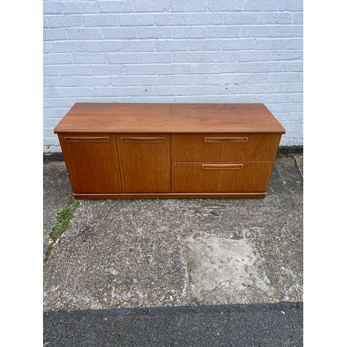 238 - A Meredew teak sideboard, fitted with a pair of cupboard doors and two drawers -