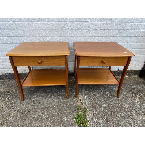 239 - A pair of teak bedside tables, each with single door over shelf -