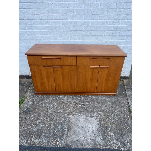 240 - A Meredew teak sideboard, fitted with two drawer over a pair of cupboard doors -