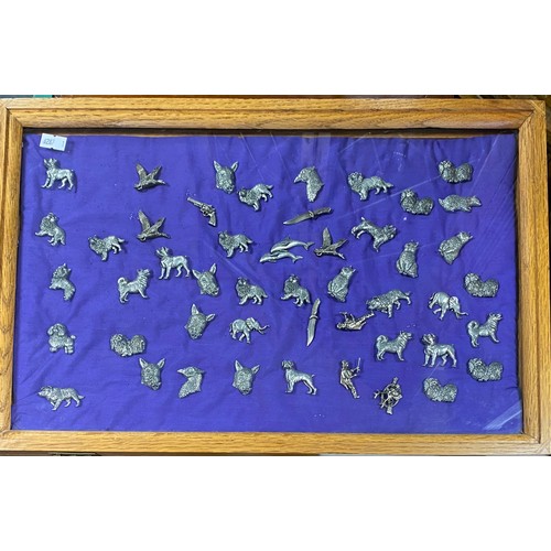 323 - Approximately 50 pewter pins in display cabinet -