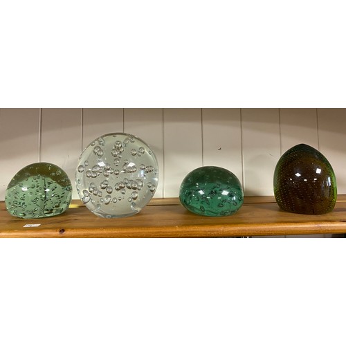 80A - A controlled bubble clear glass dump weight, two smaller green glass examples and a modern paperweig... 