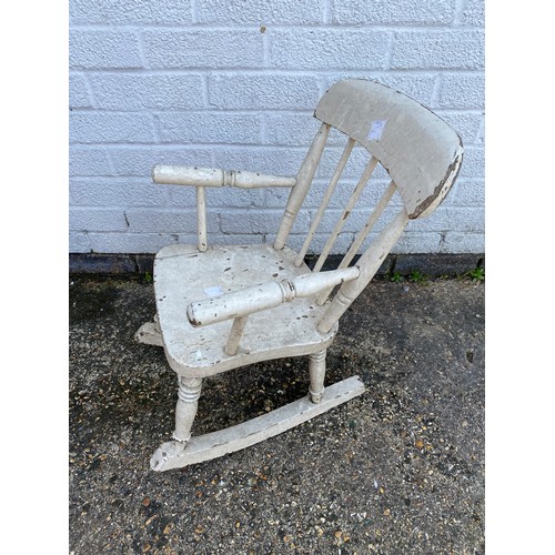 222A - An antique painted pine child's rocking chair -