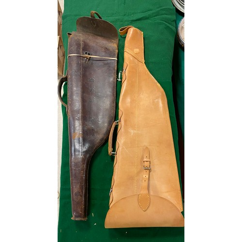 366 - A leg of mutton gun case, with matching gun belt and gun end inside and another leg of mutton gun ca... 