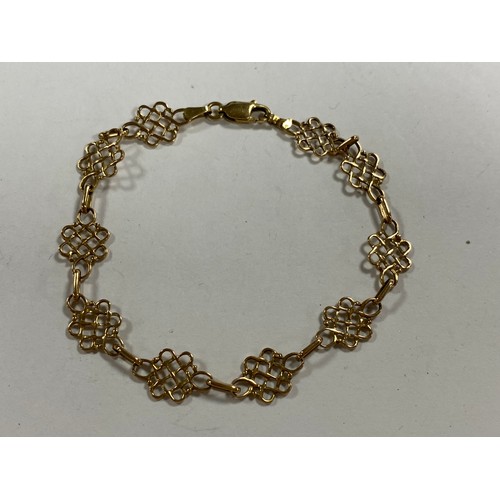 3 - A 9ct gold bracelet, composed of openwork panels -