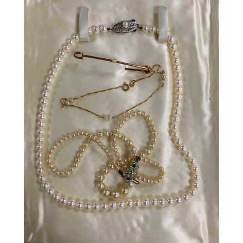 10 - A 9ct gold and seed pearl bracelet, together with a brooch, a Mikimoto silver mounted pearl necklace... 