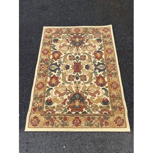 295 - A modern red and beige Turkish rug, approximately 230 x 160cm -