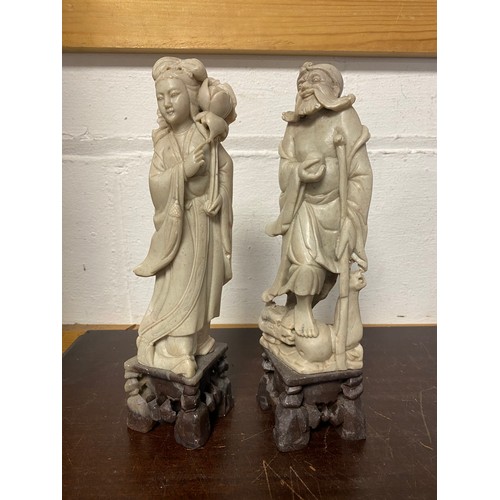 96 - A pair of Chinese carved soapstone figures -