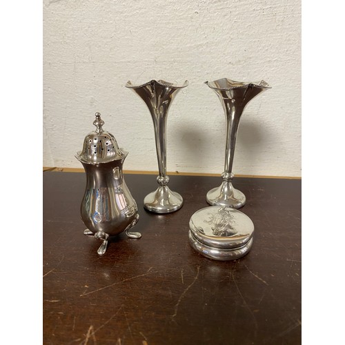 46 - A pair of early 20th century filled silver bud vases, together with a silver pepper and a pill box (... 