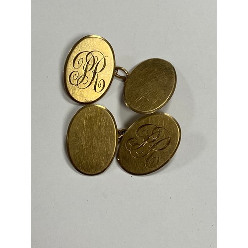 49 - A pair of 9ct gold cufflinks, with oval terminals, initialled P R -