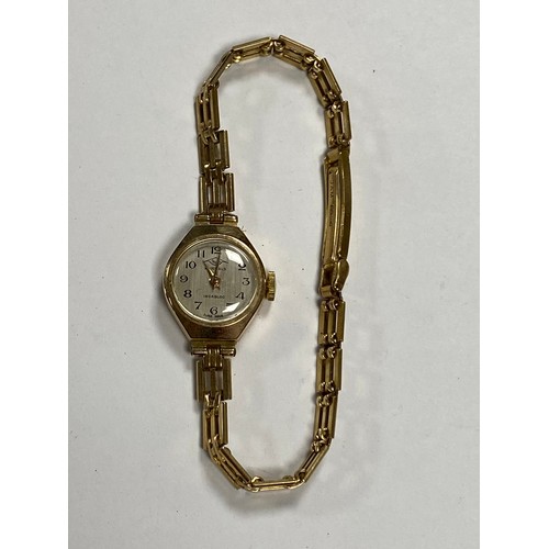 50 - A lady's 9ct gold cased wristwatch, the circular dial signed Talis, to 9ct bracelet strap -