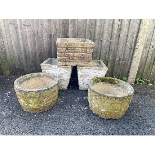 407 - A pair of barrel shaped garden planters, another pair of planters and a single planter -