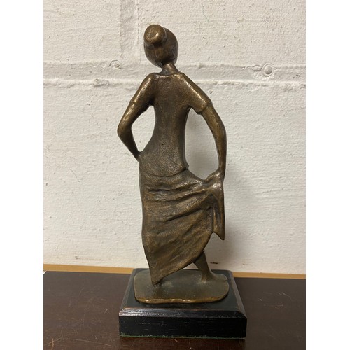 108 - A modernist bronze of a dancer, on stained base -