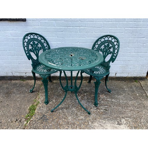 418 - A cast aluminium garden/patio table and two chairs -