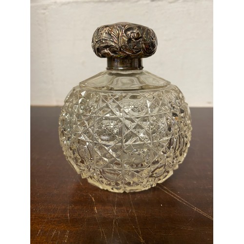 77 - A silver mounted cut glass scent bottle -