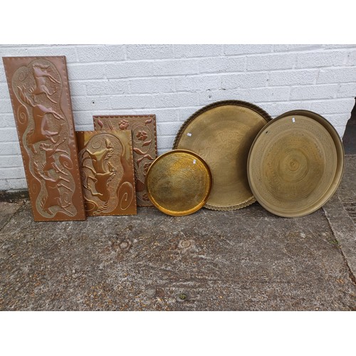 364 - Three brass tiffin trays, together with three copper plaques  -