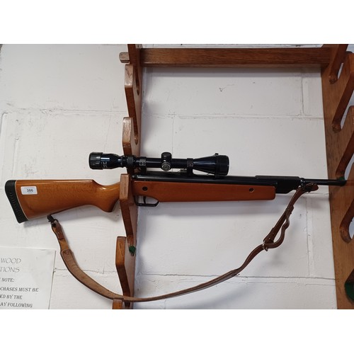 386 - An Original .22 air rifle, with scope and case -