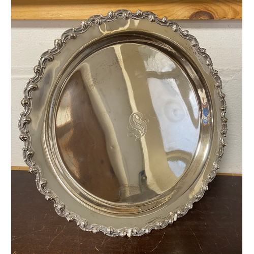 A 20th century silver salver, stamped sterling, with rococo rim -
