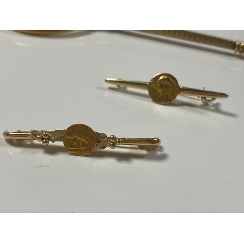 4 - Two French yellow metal bar brooches, each applied with medallions together with a pair of lorgnette... 