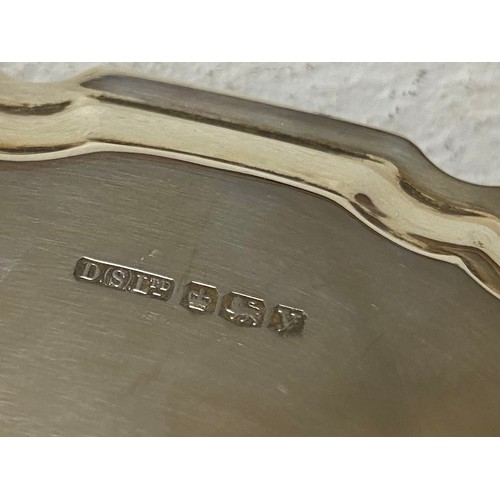 15 - A George VI silver card tray, Sheffield 1941, raised on three legs -
