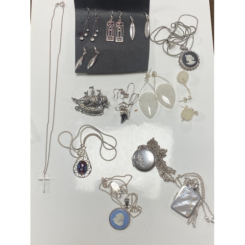 32 - A quantity of mostly silver jewellery, including charm bracelet, bangles, locket and other pendants ... 