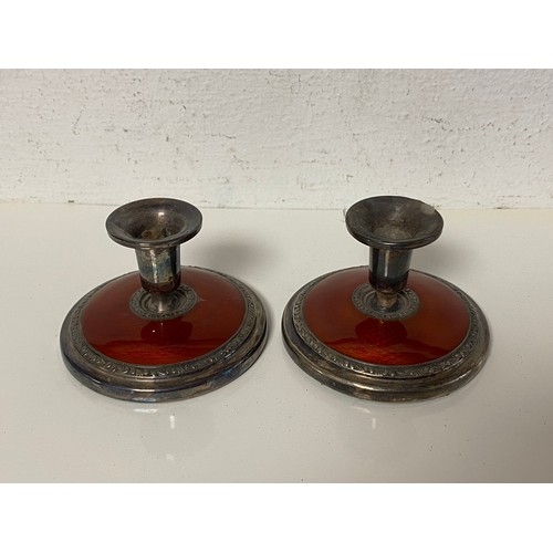 10 - A pair of Norwegian silver and guilloche enamel dwarf candlesticks, with red enamel detail -