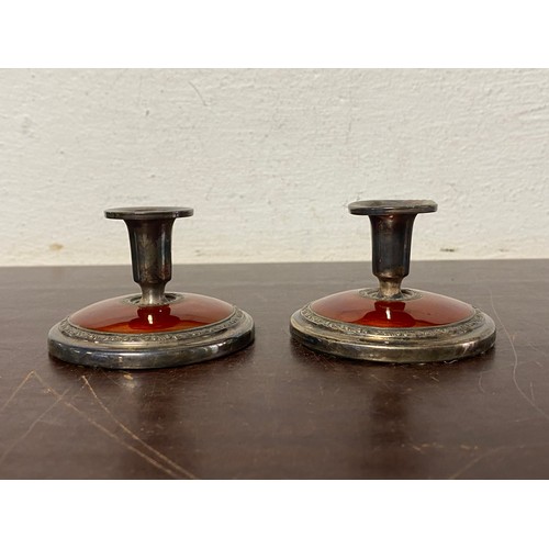 10 - A pair of Norwegian silver and guilloche enamel dwarf candlesticks, with red enamel detail -