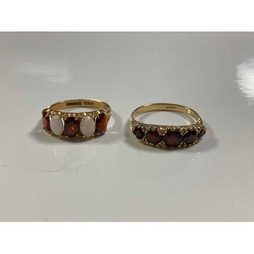 15 - A 9ct gold opal and garnet five stone ring, together with a garnet five stone ring (2) -